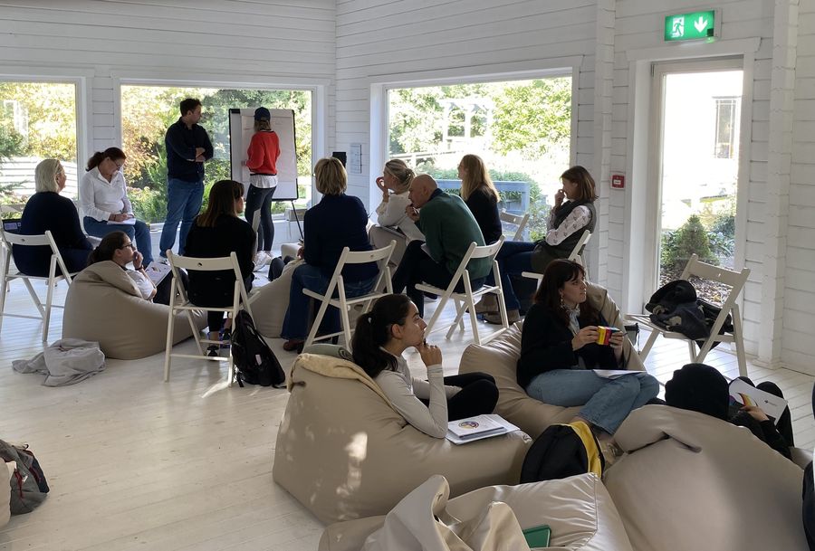 A team in a bright, informal off-site working session